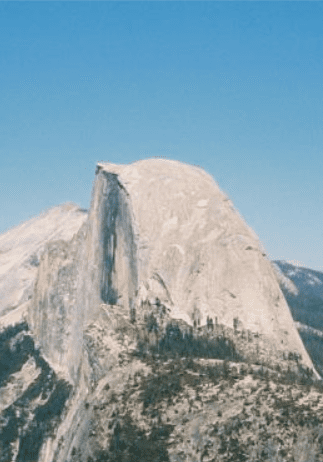 A mountain with snow on it's side.